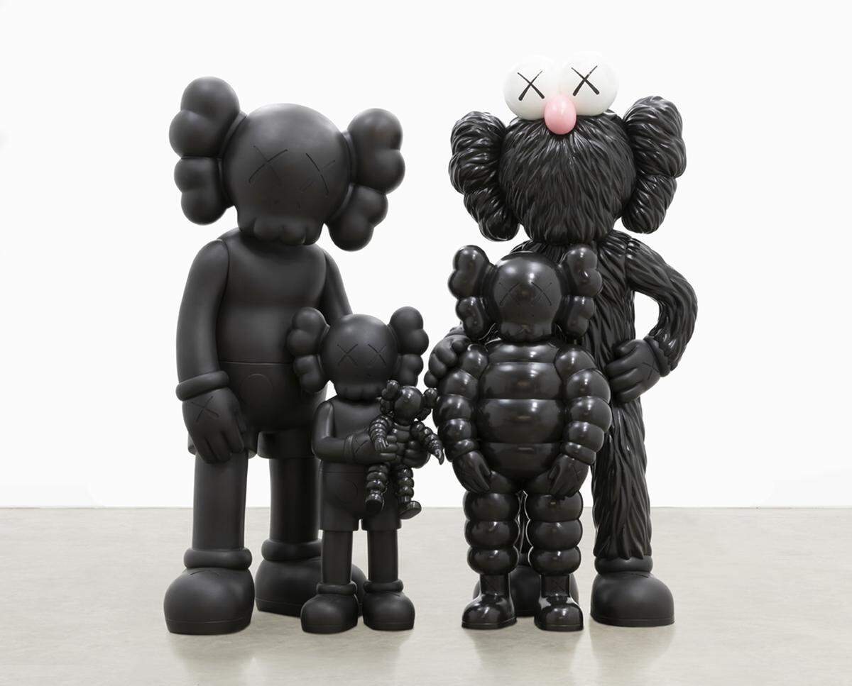 “Family,” a 2021 sculpture of four of the KAWS’ characters in a family portrait pose, is part of the exhibition at Crystal Bridges Museum of American Art.
