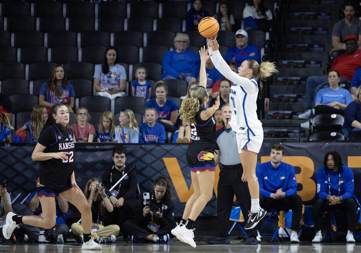 BYU’s Delaney Gibb shoots over Kansas’ Sania Copeland during the first half of their WBIT semifinal game at Wichita’s Koch Arena on Monday.