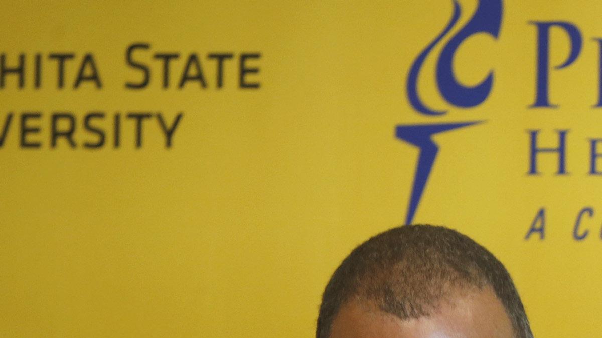 Wichita State University athletic director introduces the new baseball coach Todd Butler during a press conference at Eck's Stadium's All-American Club. (June 17, 2013)