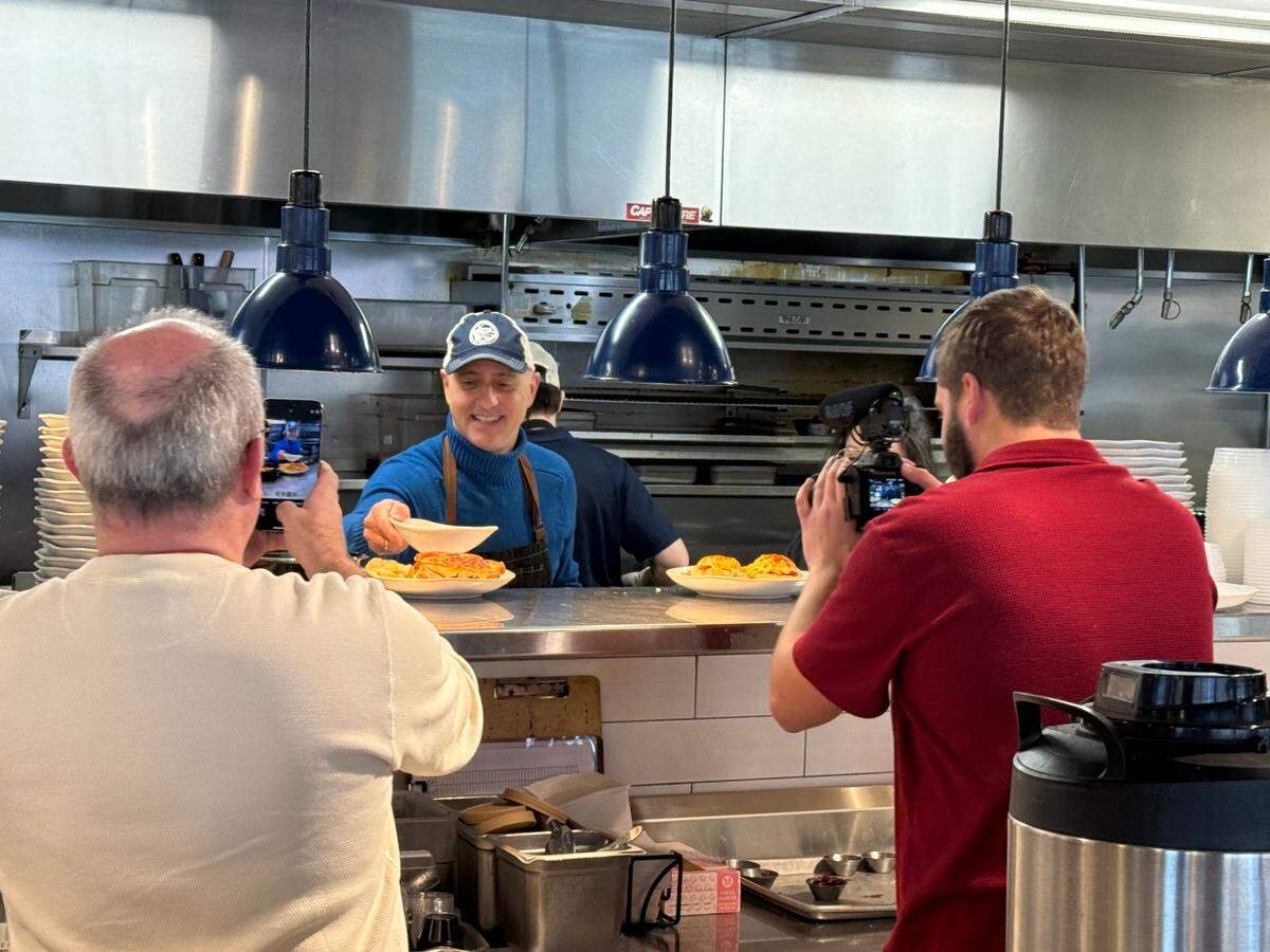 Former Olympic gold medalist Brian Boitano was seen working in the kitchen at the downtown HomeGrown on Thursday.