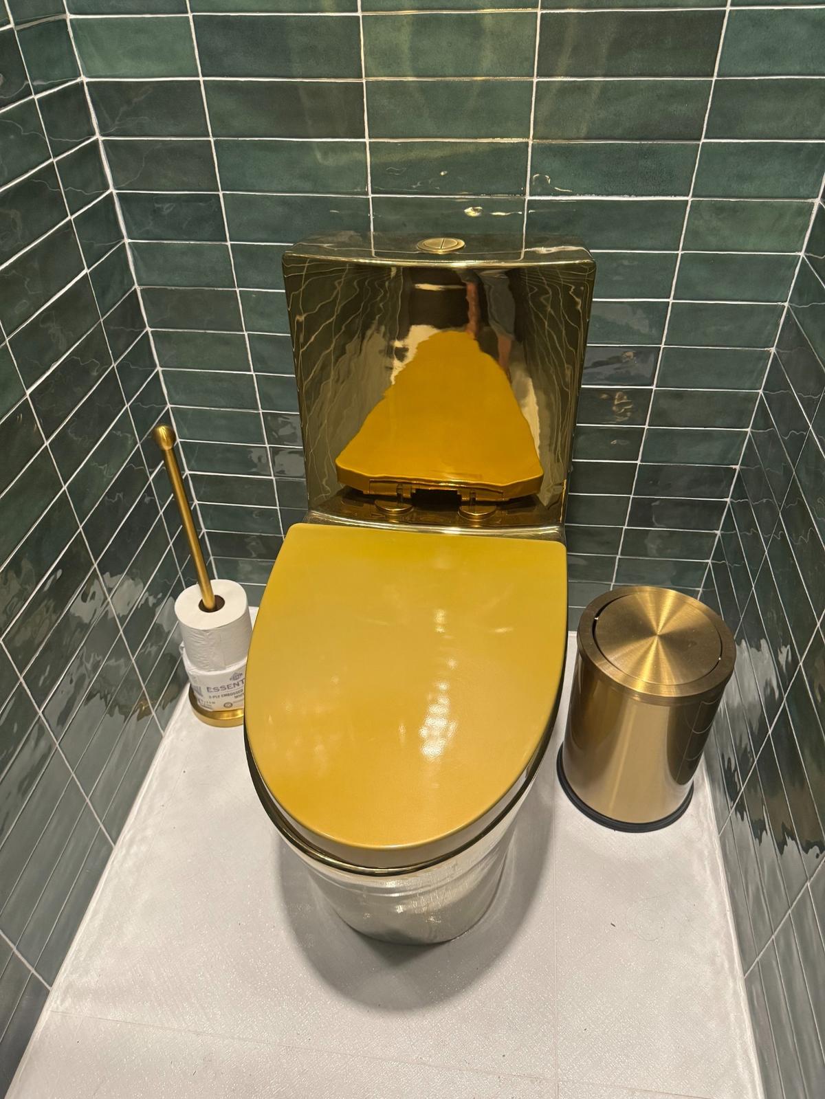The women’s restroom at KVH Chophouse has golden toilets.