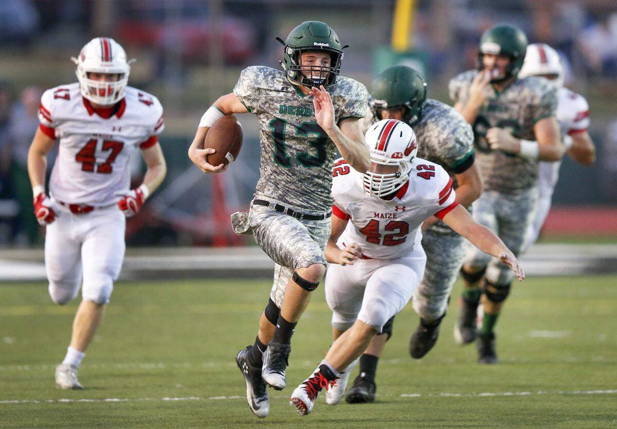 Derby QB Grant Adler (13) heads downfield for a large gain against Maize during the second quarter at Derby. (Sept. 15, 2017)