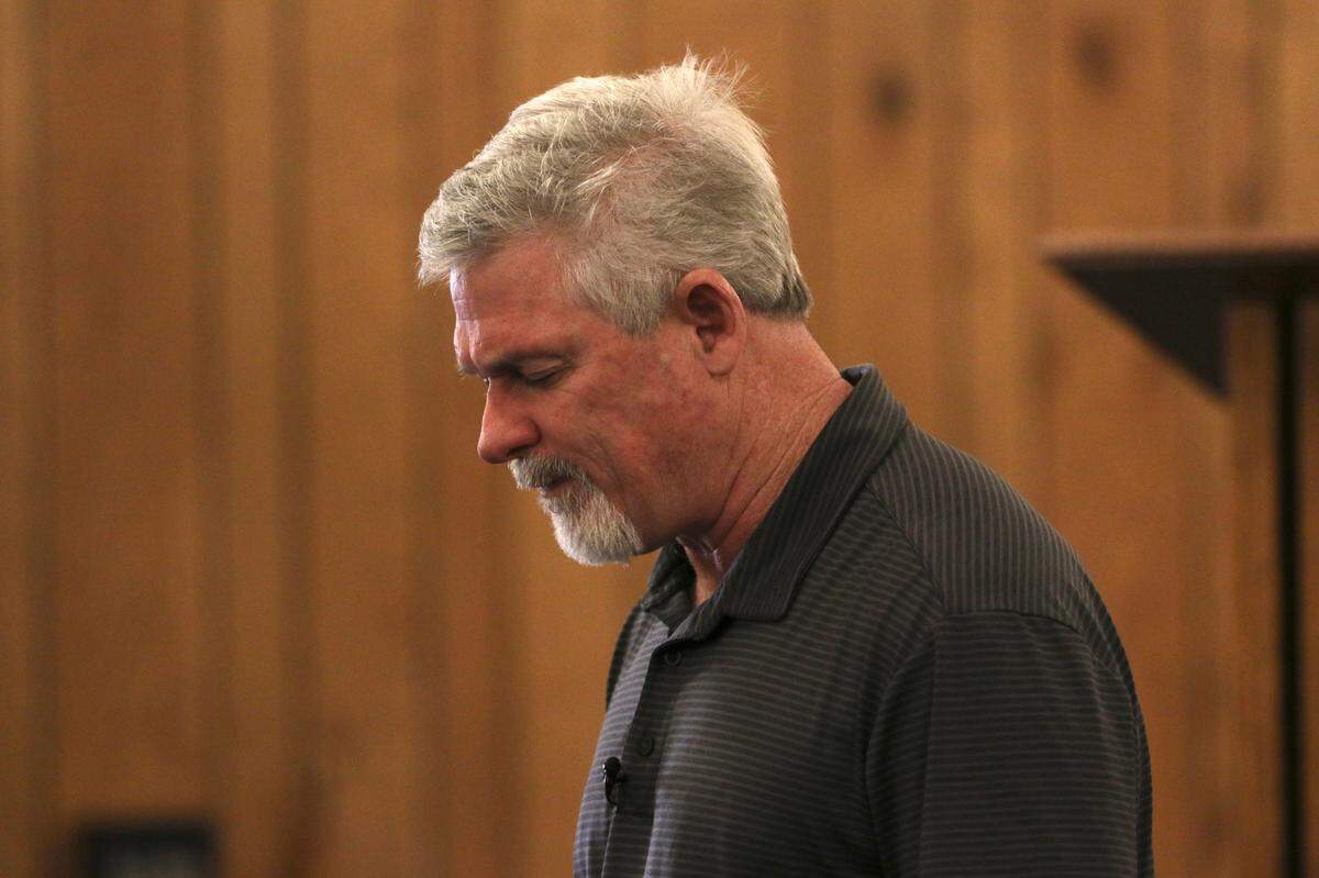 West Side Church of God pastor Forest Cornwell leads a prayer during the church’s last service on Sunday.