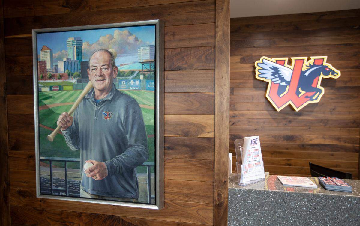 A painting of Wichita Wind Surge founder Lou Schwechheimer hangs in the office of the ball club. Schwechheimer died of COVID-19 in what should have been the team’s first season in 2020.