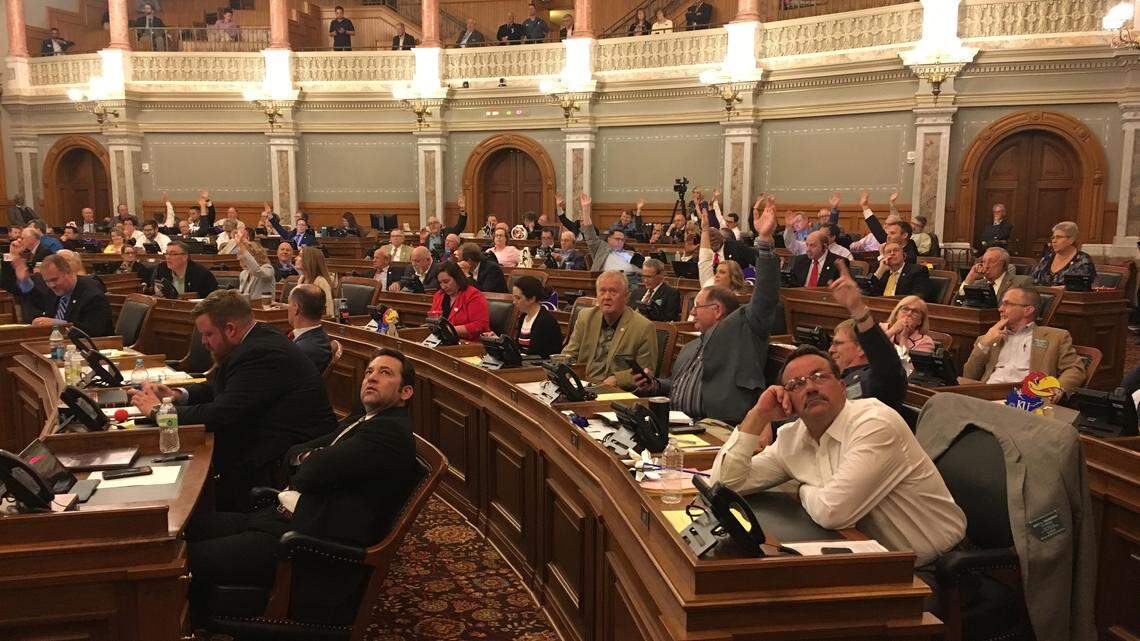Kansas representatives Thursday night during a vote on legislation that would allow adoption agencies to refuse placements to LGBT couples based on religious beliefs.
