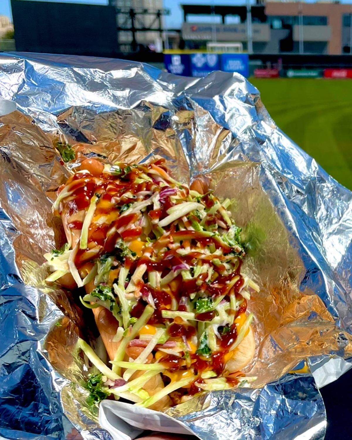 The new Wichita Dog at the Riverfront Stadium is topped with pulled pork, pinto beans, cole slaw and barbecue sauce.
