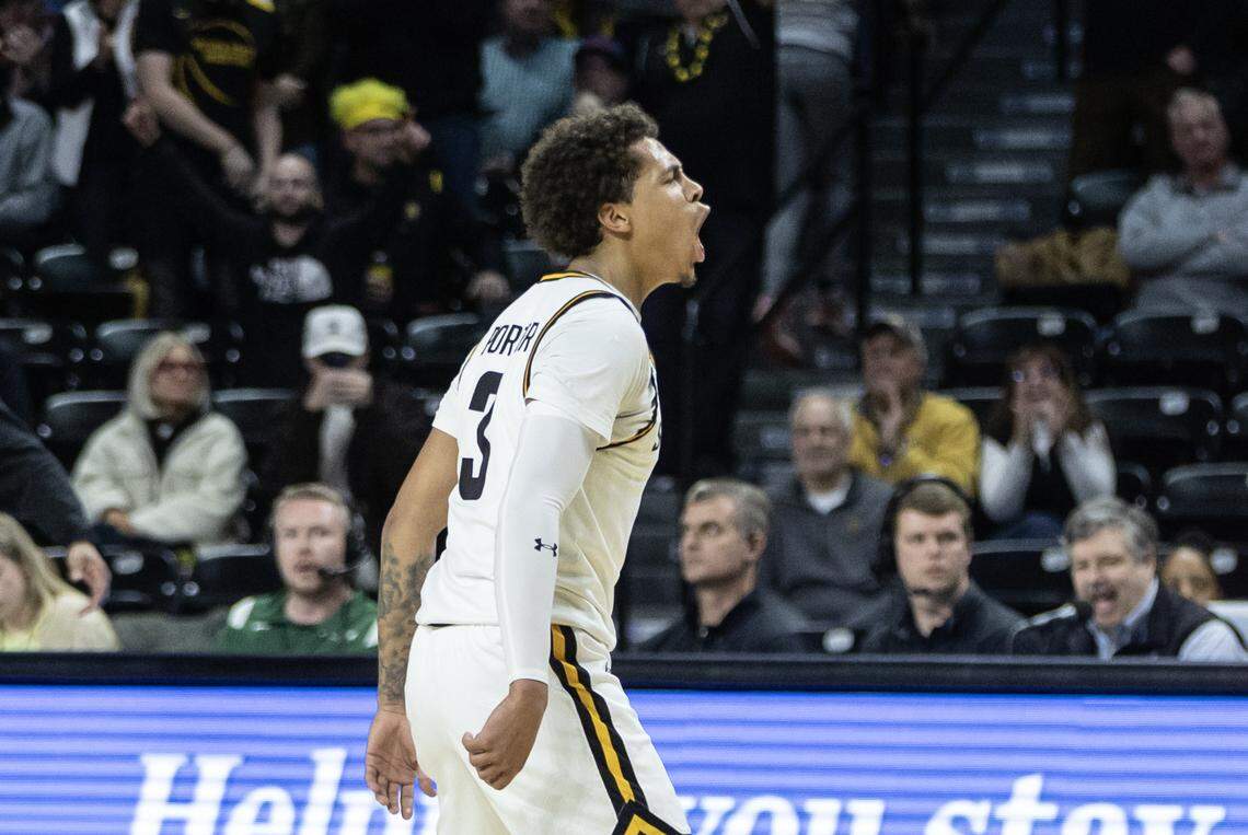 Wichita State’s Craig Porter Jr., celebrates a three pointer against Tulane last in the second half. Just when it appeared the Shockers were going to put the game way, Tulane forced overtime and went on to win 95-90.