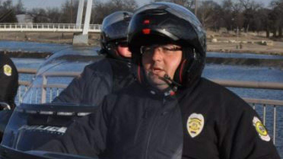 Stacy Woodson, a member of the Wichita Police Department’s motorcycle unit, was killed in a collision while off-duty. His son also died.