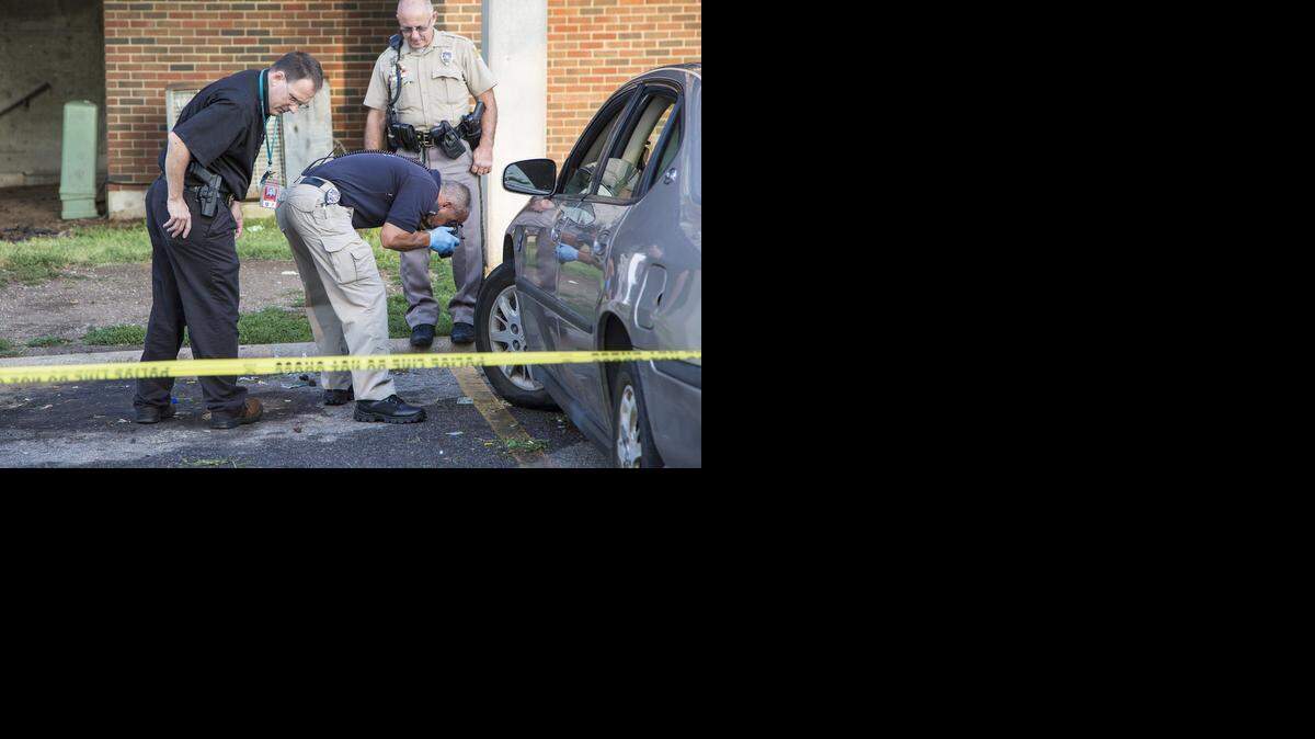 Wichita police investigate the scene of a quadruple shooting at the Calvary Towers apartments in the 2600 block of North Grove on Thursday morning. (Aug. 7, 2014)

