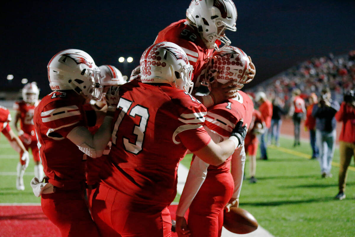 Maize players celebrate #1 Caleb Grill’s first touchdown of the night against Maize South. (November 2, 2018)