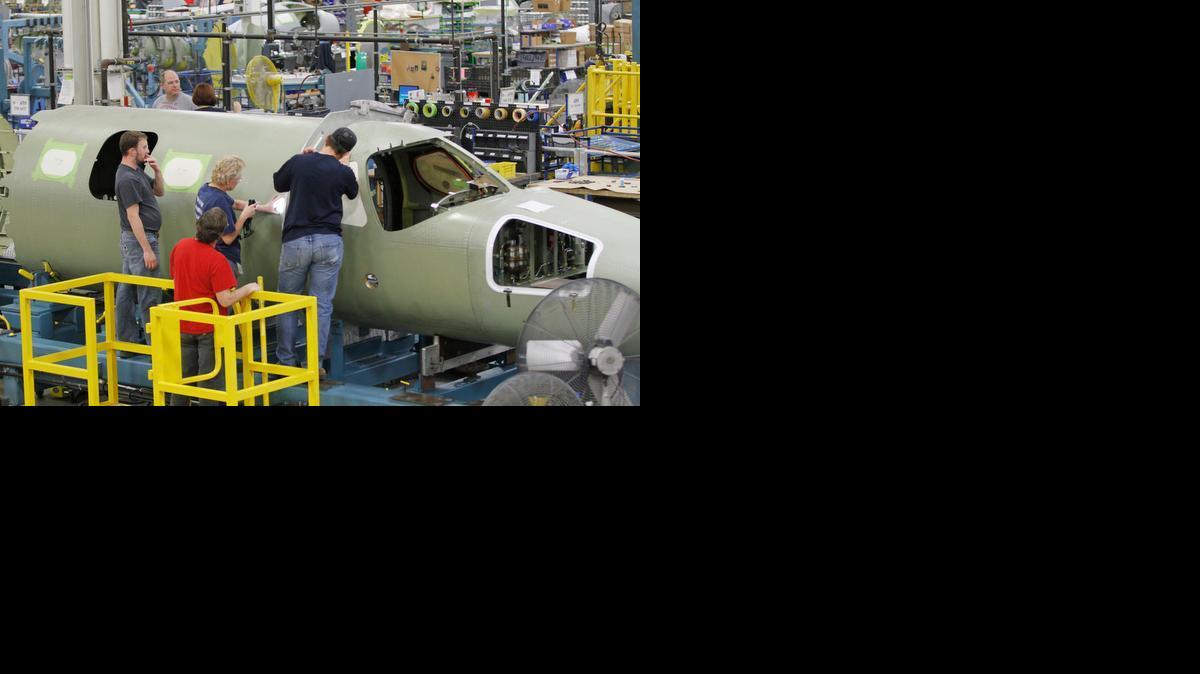 Cessna employees work on a Citation Mustang on the assembly line at Cessna’s Independence Plant. (Jan. 9, 2013)

