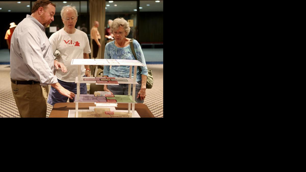 Dan Meehan, left, with HBM Architects in Cleveland, talks with Tim and Linda Paul about what they would like to see in a new Wichita Central Library. The meeting was one of three community discussions on Tuesday about the vision of the Wichita Central Library. (June 10, 2014)

