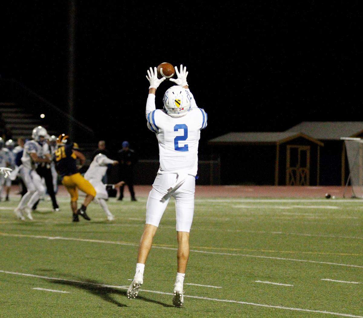 Kapaun’s Jacob Nye reaches up for a catch during the Crusaders’ 55-26 loss to Wichita Northwest on Friday. (Sept. 28, 2018)
