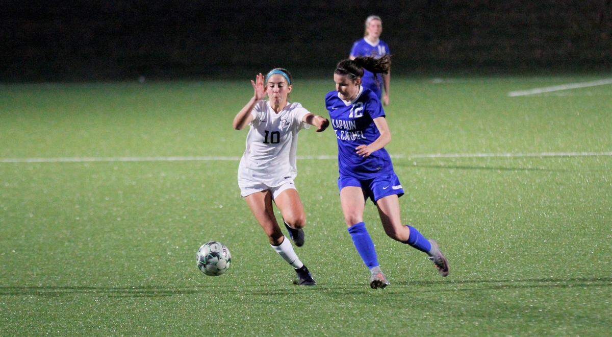 Trinity Academy’s Sophie Klaver and Kapaun’s Emily Shepherd