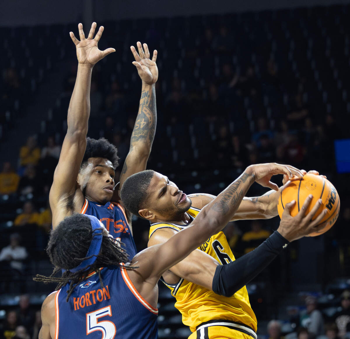 Corey Washington runs into resistance while trying to drive the lane during the second half of their game against UTSA on Wednesday night. 