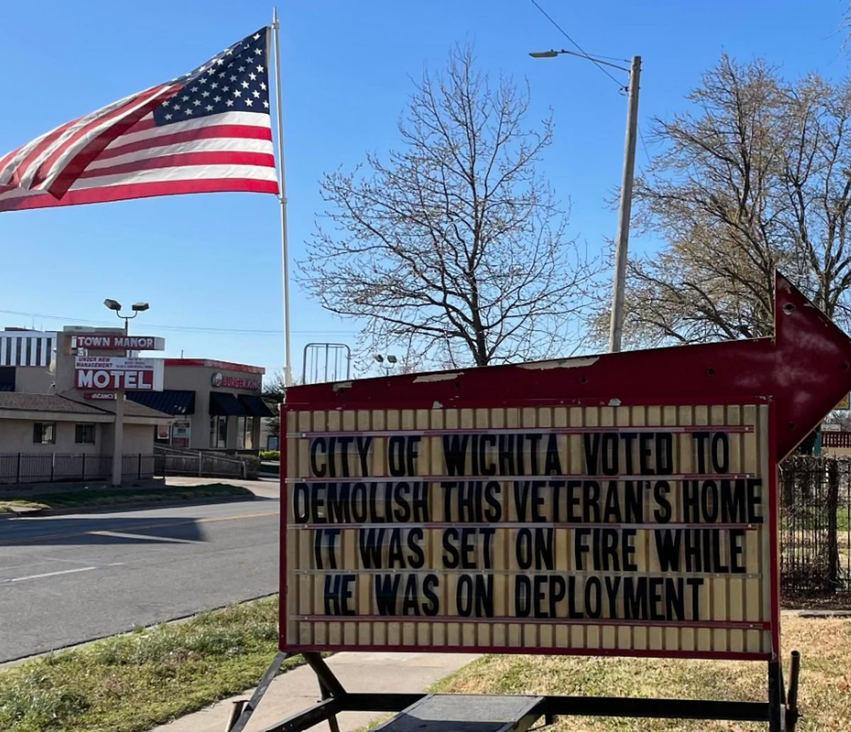 Veteran Don Lobmeyer put this sign in the front yard of his north Broadway property the day after the Wichita City Council voted to condemn the house.