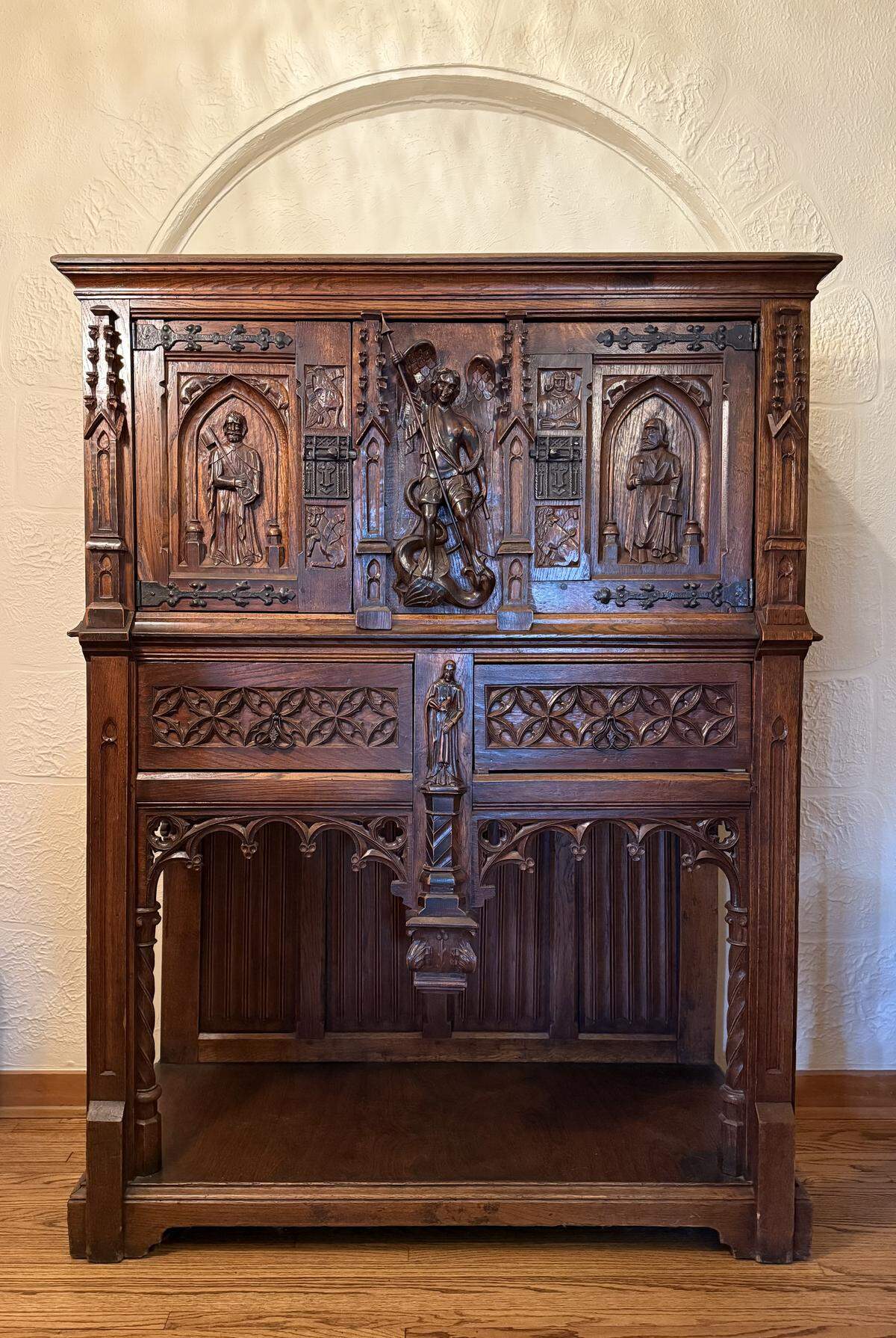 This neo-Gothic cabinet was original to the lobby at Wichita’s 1929 Commodore apartment and hotel. It held a massive radio, a new technology at the time. The building was wired with speakers to each room, and residents and guests could turn on the radio if they wanted to listen to the one station that was on.