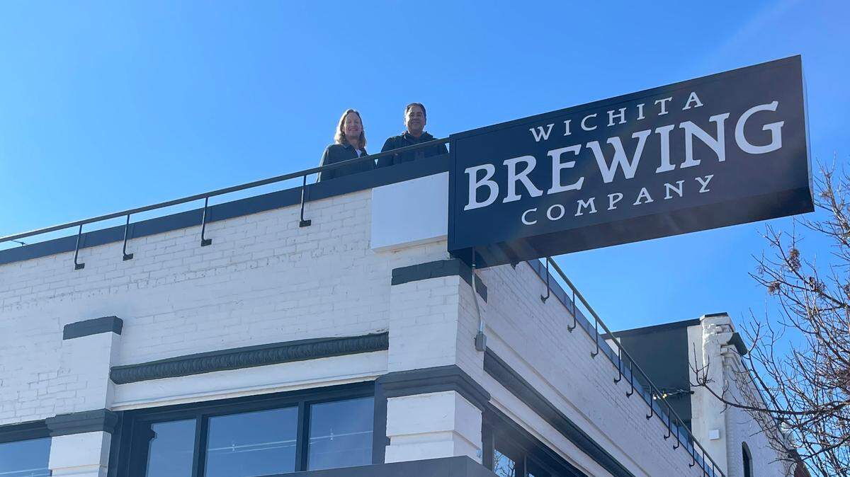 Ben Simon, left, and Joe Fernandez are pictured on the rooftop patio at the soon-to-open Wichita Brewing Company in Delano. The two are among a group of partners that just purchased the majority interest in Wichita Brewing Company’s restaurants.