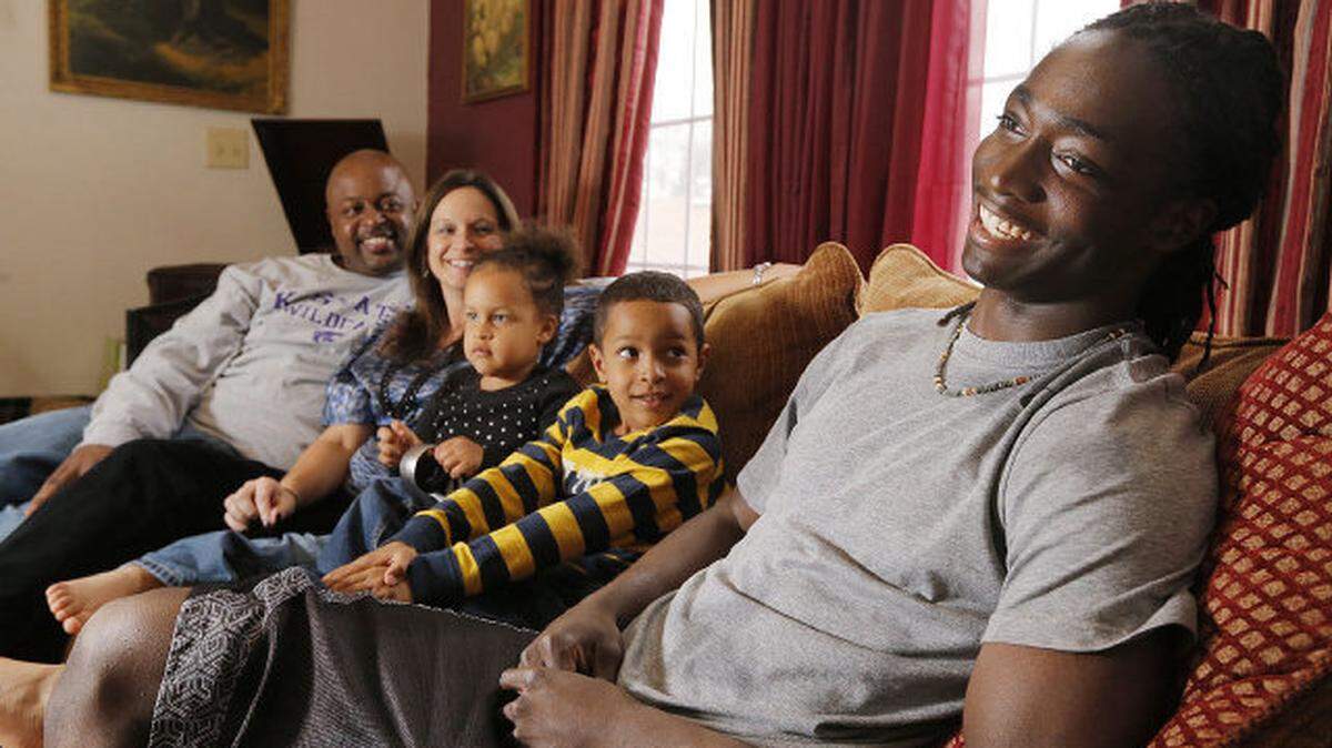 South senior Davontae Harris jokes around his cousin Antonio Baker, his wife, Kristy, daughter Jayla, 3, and son Devin, 6, while hanging around at home Tuesday, April 23, 2013.