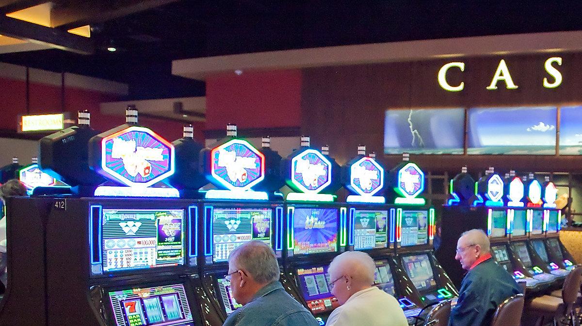 Customers play slot machines at The Kansas Star casino Wednesday, Dec. 12, 2012. The casino opened a portion of its permanent location Wednesday, with additional games and restaurants scheduled to open Dec. 21st.