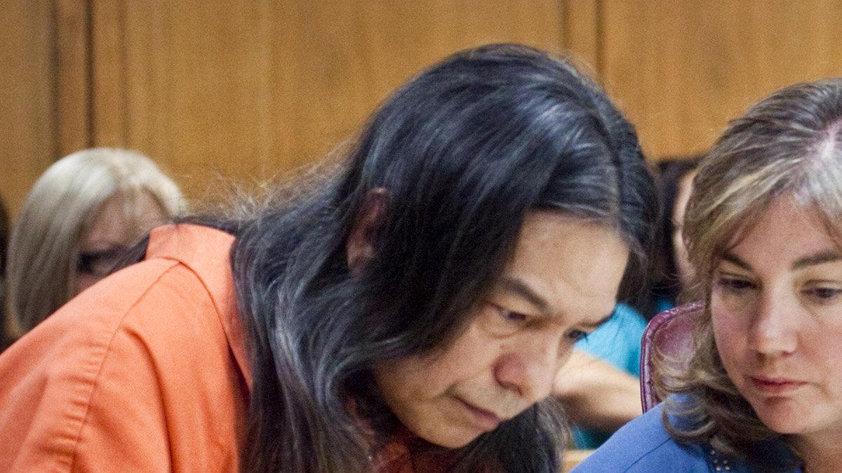 Daniel U. Perez, 52, talks with his attorney Alice  Osburn during his preliminary hearing Tuesday, May 29, 2012. Perez has been charged with premeditated first-degree murder in the death of Patricia Hughes, 26. Prosecutors are giving evidence during Perez's hearing  to justify a murder trial for the commune leader accused of killing Hughes, whose 2003 death was initially believed to be an accidental drowning.