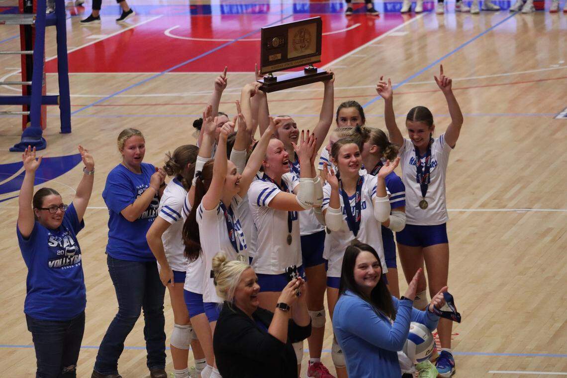 The Halstead volleyball team celebrates after winning the Class 3A state championship, the first title in program history.