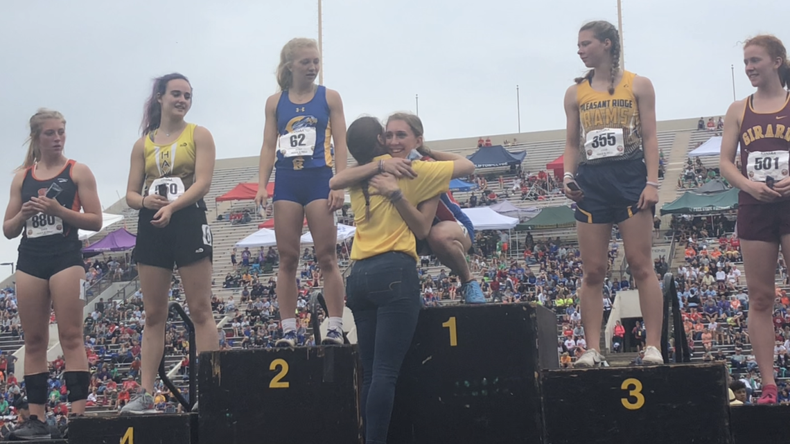 Cheney senior Layne Needham (center) hugged her older sister, Taylor, after Layne won her fifth state championship in total with a 300-meter hurdles Class 3A title at the state track meet at Cessna Stadium on Saturday.