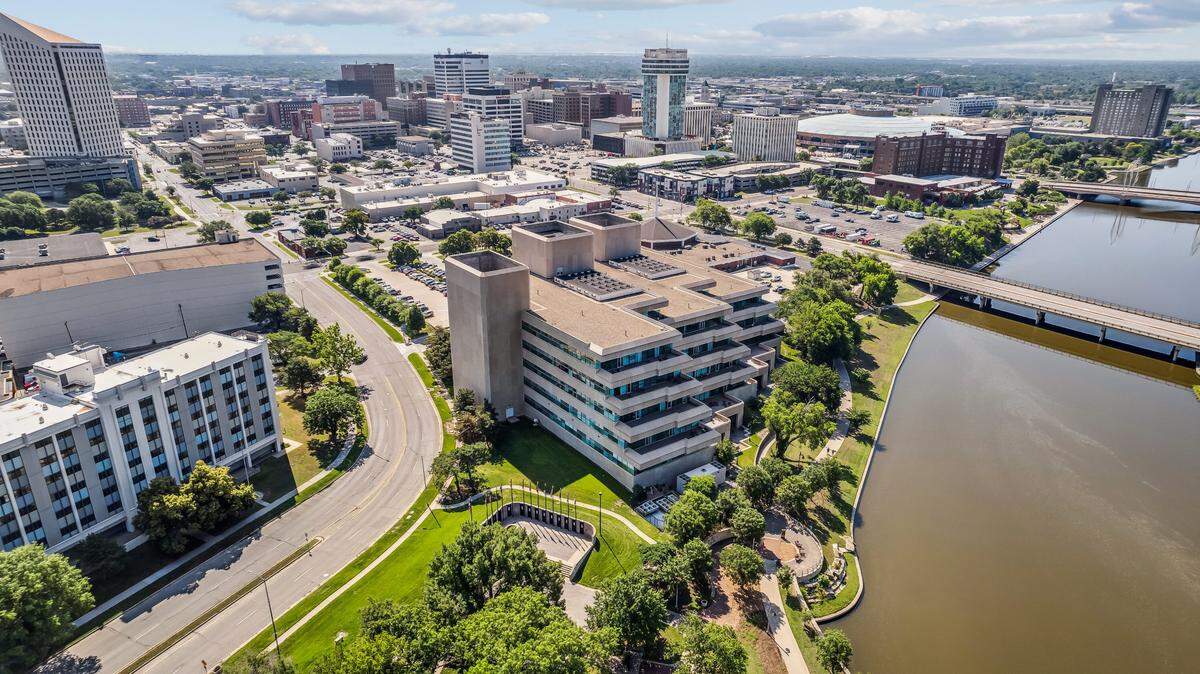 Slawson Cos. is trading one river view for another by moving from River Park Place to the Farm Credit Bank Building, the large building shown here.