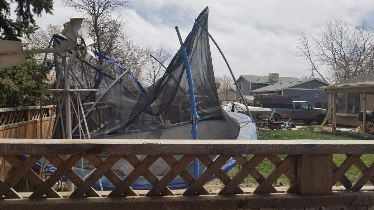 The wind-blown trampoline started a "racially driven" feud between neighbors in Thornton, Colorado.