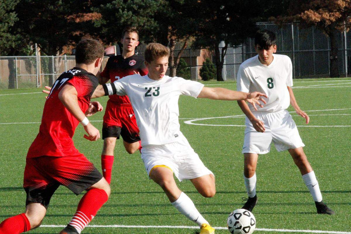 Carroll striker Carson Lee fires a left-footed shot at goal during the Golden Eagles’ 3-0 win at Maize on Tuesday. (Aug. 28, 2018)
