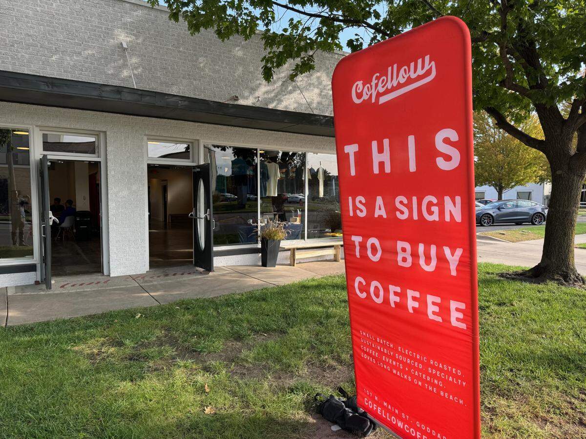 Signs and flags beckoned customers into the Cofellow Coffee popup on Monday at 1812 W. Douglas.