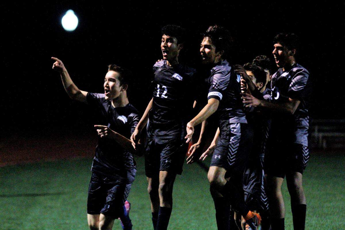 The Campus Colts celebrate Hassan Al-Amood’s goal to open the scoring in their 4-0 win over Wichita South in the regional semifinal Tuesday. (Oct. 23, 2018)