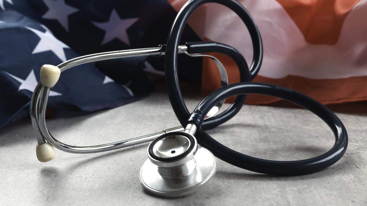 An image of a stethoscope in front of an American flag