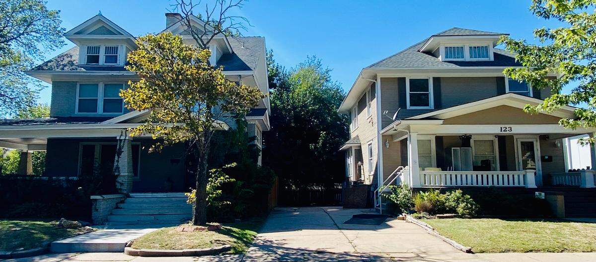 The owners of Happiness Plaza have purchased and are demolishing three houses with plans to build a new parking lot, including these two at 123 S. Clifton and 125 S. Clifton.