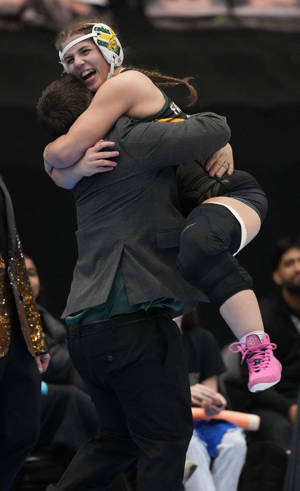 Makayla Faulker from Basehor-Linwood reacts after beating Kapaun’s Bella Green in the 5A State Championship wrestling tournament in February 2026.