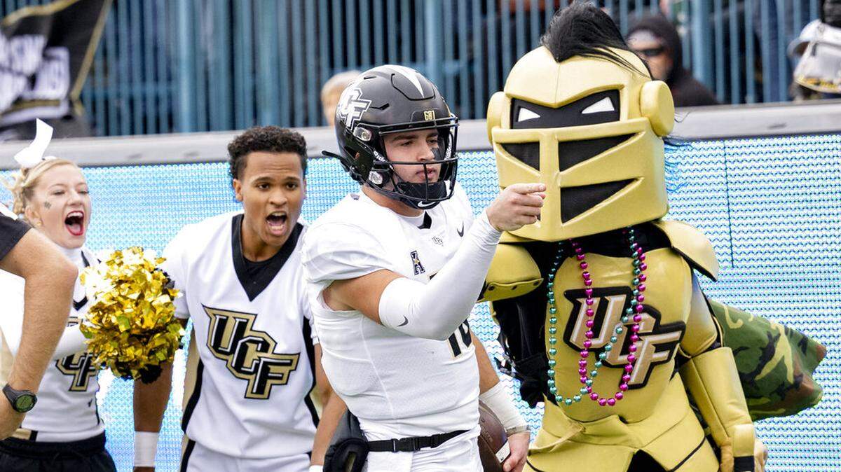 UCF quarterback John Rhys Plumlee signals a first down in the first half during an NCAA college football game against Tulane in New Orleans, Saturday, Nov. 12, 2022. (AP Photo/Matthew Hinton)