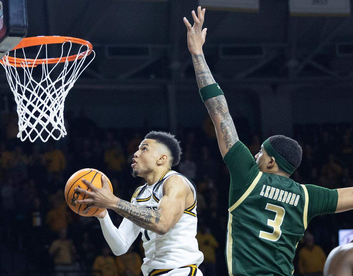 Wichita State’s Xavier Bell goes in for a layup against UAB’s Yaxel Lendeborg during the first half on Thursday night at Koch Arena.