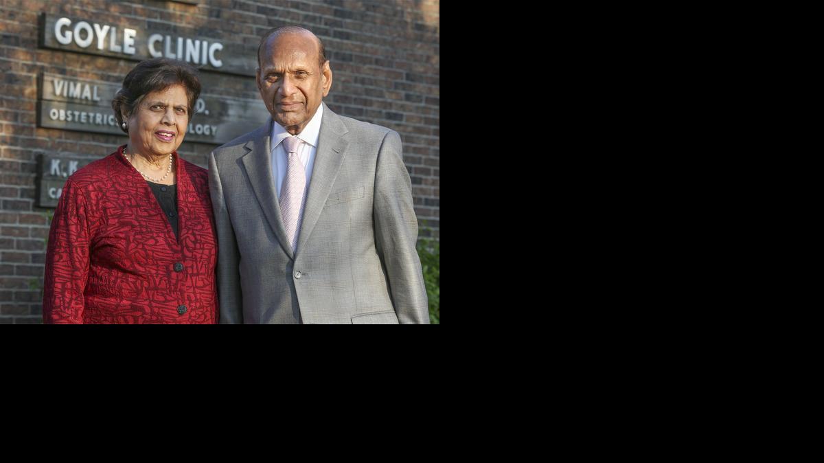 Krishan, right, and Vimal Goyle in front of their old clinic at 11th and St. Francis. They have moved to New York after running the clinic for 35 years and are selling it. (April 17, 2014)

