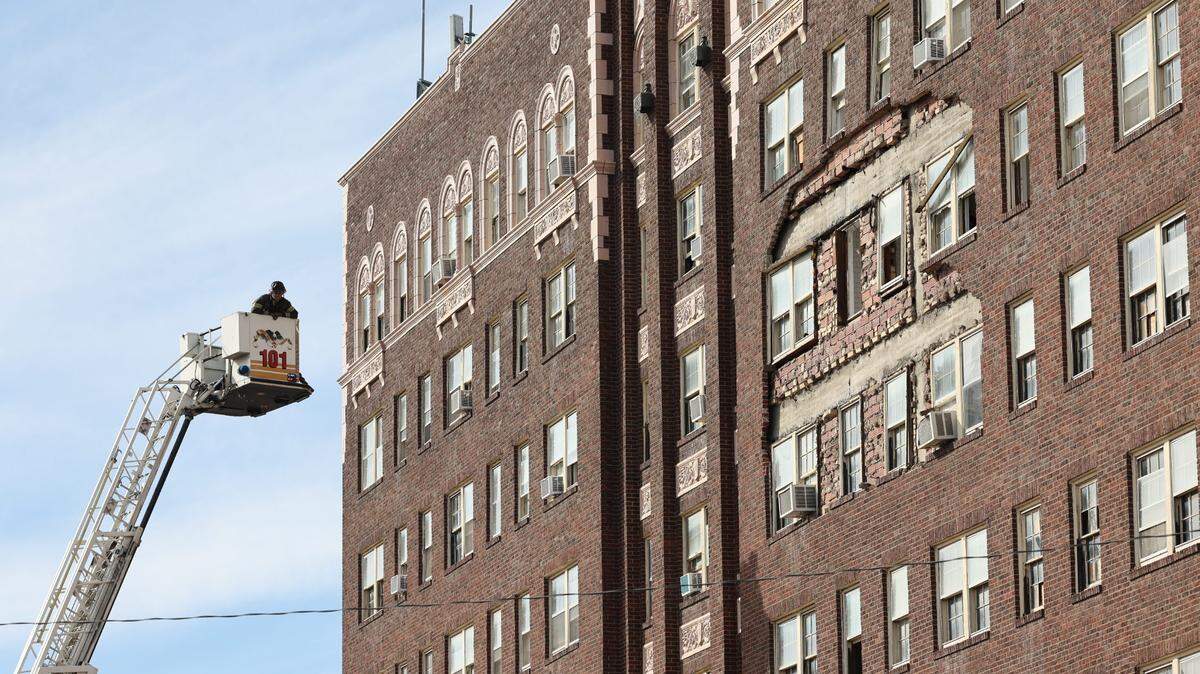 Bricks have fallen off the side of the former Commodore building at Broadway and Elm.