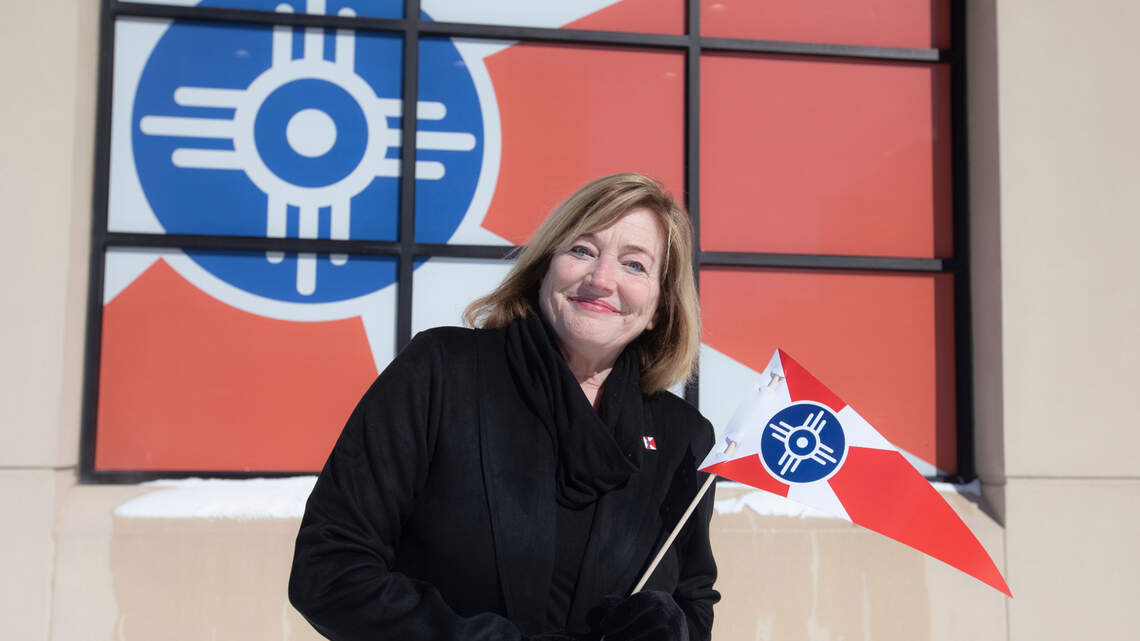 The masked marketer: Woman who sparked Wichita’s flag revolution takes a new job