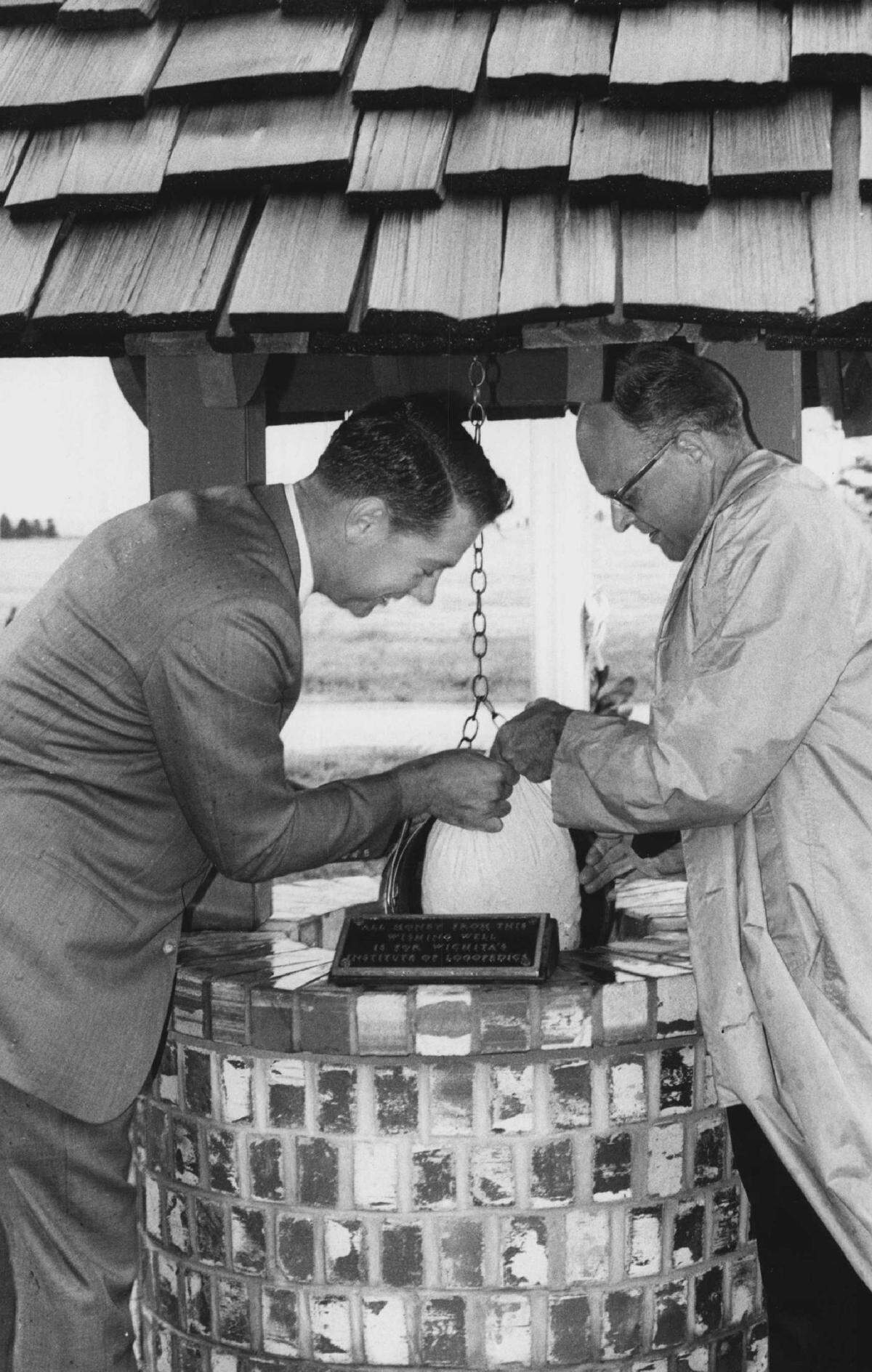Brown’s Grill West opened at 7150 W. Harry in 1966. Pictured at the wishing well that sat behind the restaurant is founder Richard Brown, right.