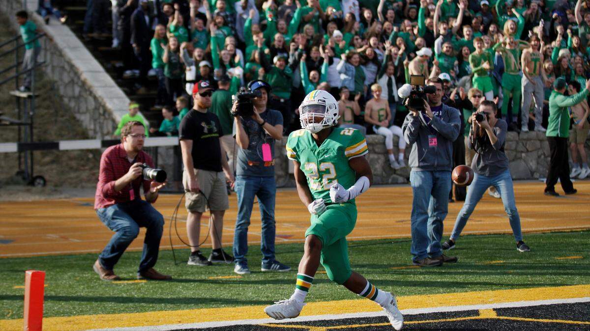 Derby running back Tre Washington celebrates one of his three touchdowns in Saturday’s 6A championship game in Emporia. (Nov. 24, 2018)