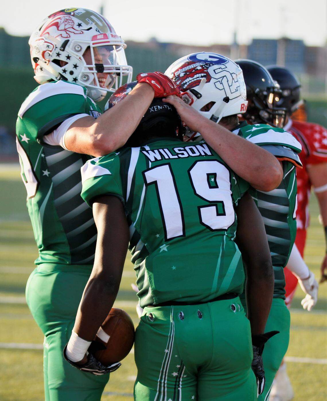 West receiver Gabe Hoover (McPherson) and offensive lineman Ethan Wampler (Smoky Valley) celebrate a touchdown catch from Larry Wilson (Valley Center).