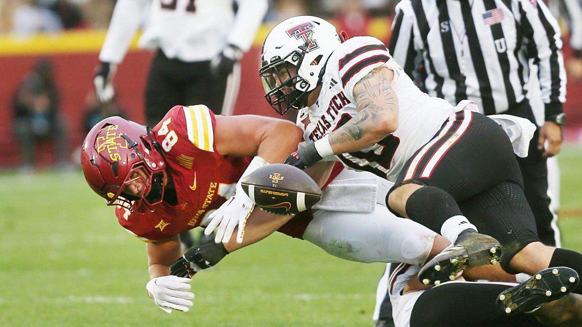 Texas Tech Red Raiders linebacker Jacob Rodriguez (10) knocks the ball away from Iowa State Cyclones tight end Gabe Burkle (82), forcing a fumble during the third quarter of a game at Jack Trice Stadium.