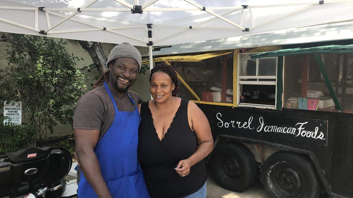 Sorrel and Christine Rhoden are now serving their authentic Jamaican cuisine in the parking lot of the building on East Douglas they'd hoped to open in.