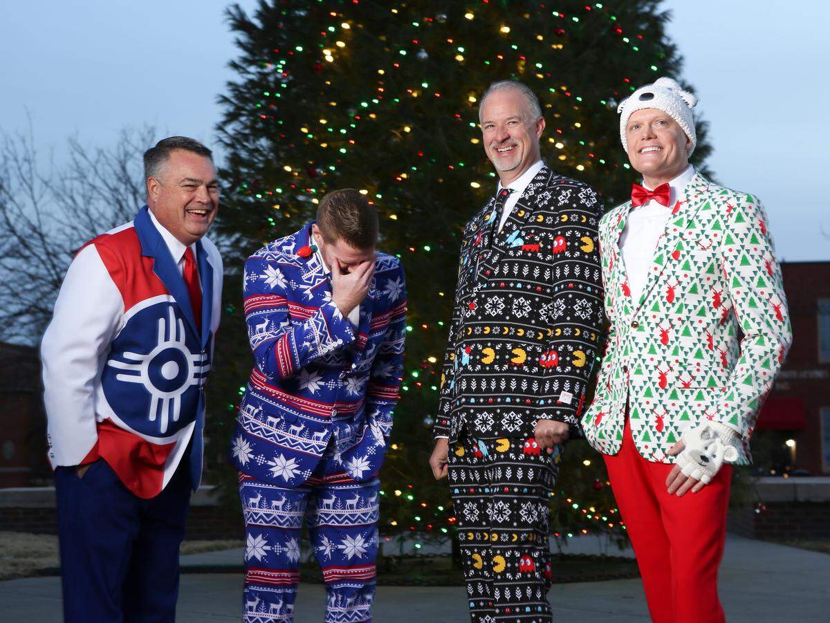 (Left to right) Bryan Fye, Brad Warzeka, Derek Sorrells and Andy McFayden show off their wacky suits. (December 23, 2018)