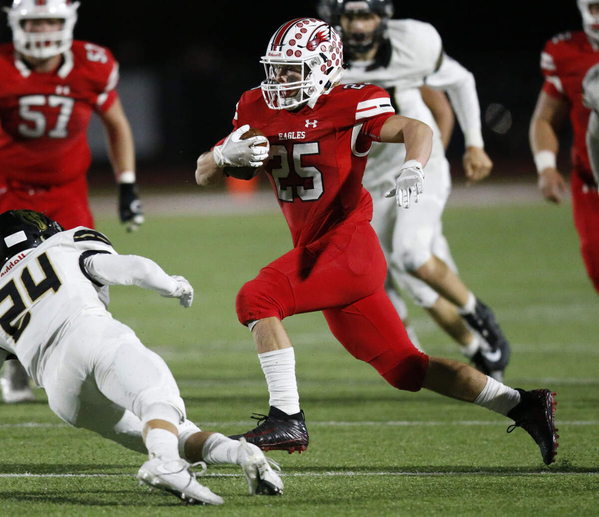 Maize running back #25 Caden Cox looks for a clear path against Maize South. (November 2, 2018)