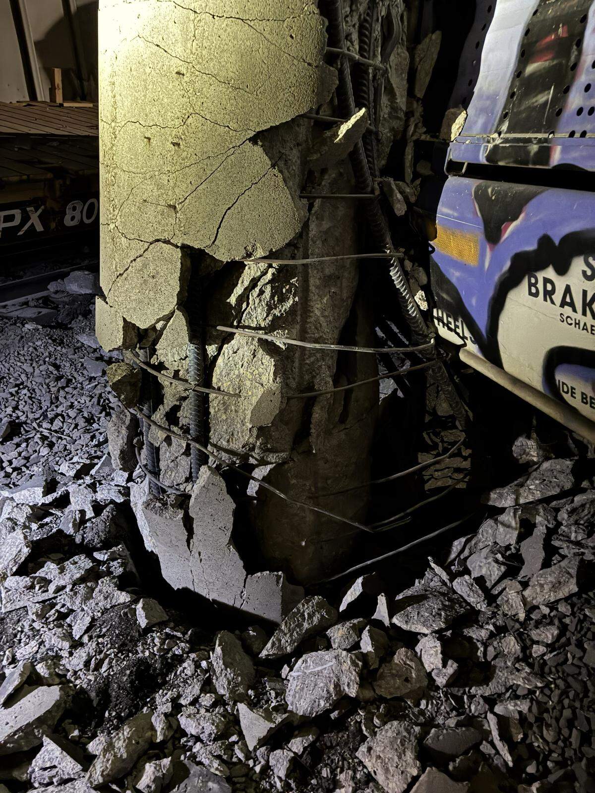 In this photo provided by the Kansas Department of Transportation, structural damage is visible on I-135 bridge columns after a Union Pacific derailment near I-135 and K-96.