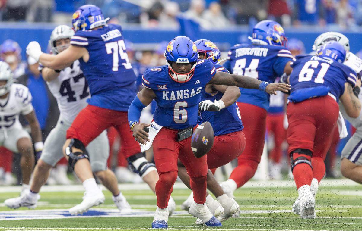 Kansas quarterback Jalon Daniels fumbles the snaps during the fourth quarter of the game against Kansas State at David Booth Kansas Memorial Stadium on Saturday, Oct. 25, 2025.