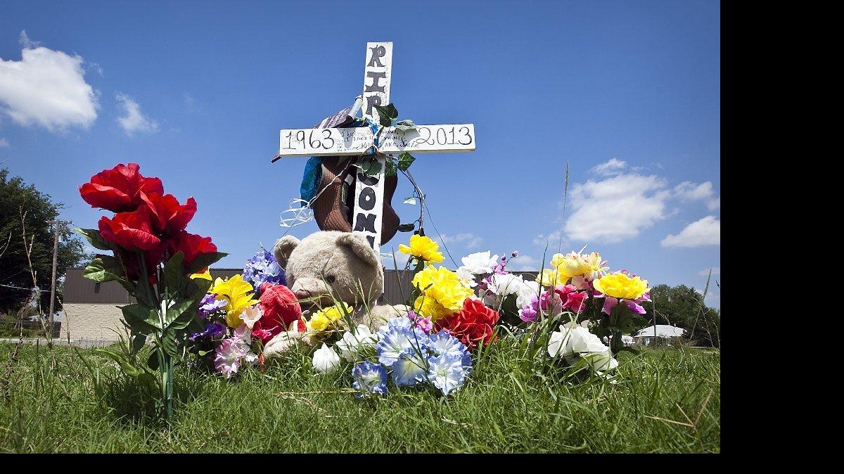 A memorial on 21st Street near Piatt stood where a car struck a horse with two riders in July, 2013.
